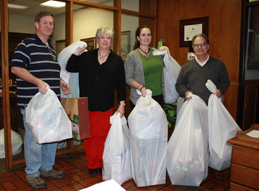 Employees gathering gifts for the Angel Tree Angel Tree Donations